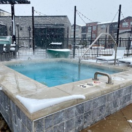 a hot tub on a snowy day