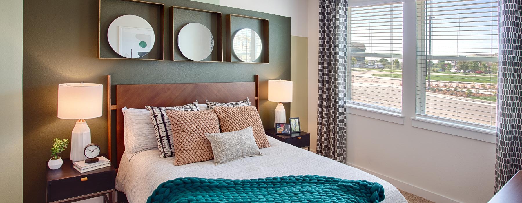 a bedroom with a large mirror